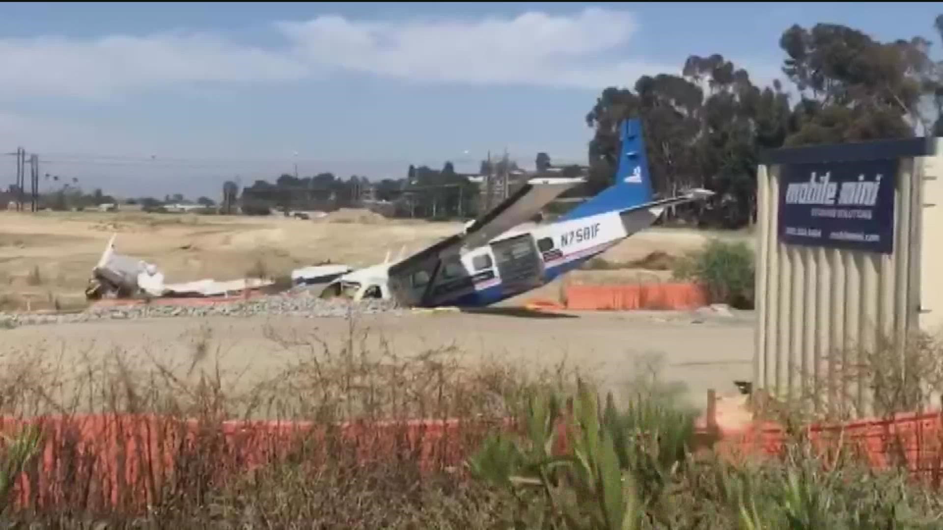 Two people were aboard a plane at the time of the crash, which happened in a field near the Oceanside Municipal Airport on Friday.