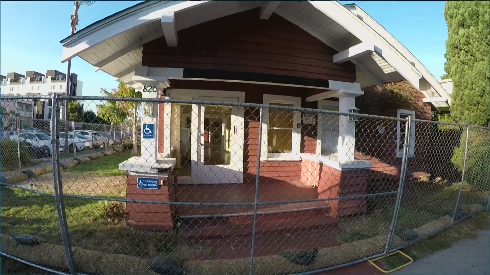 Community members rallied outside the home on Stockton Street to prevent it from being torn down.