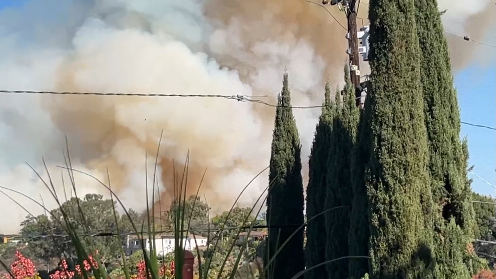 A fire is burning in the College Area and can be seen from I-15.