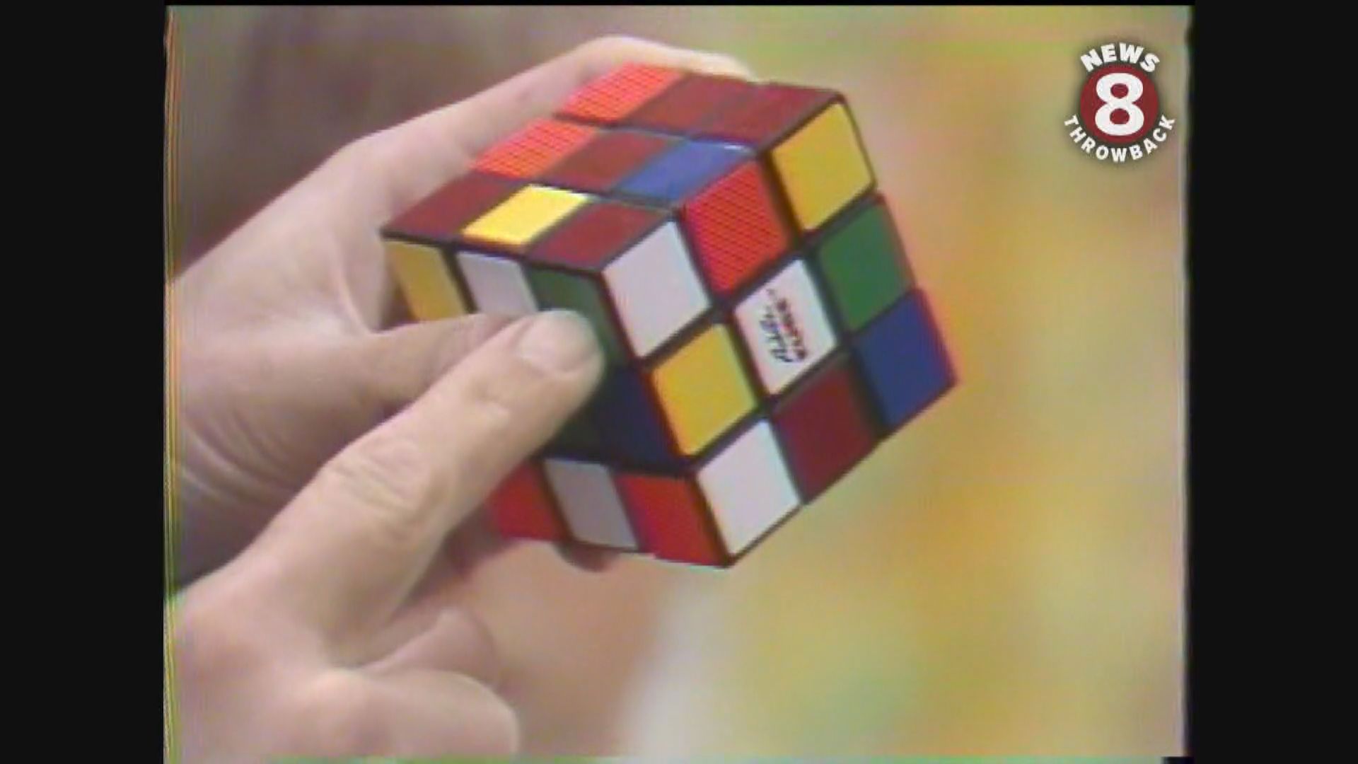 Children try to solve the hot new Rubik's cube puzzle in December 1981.