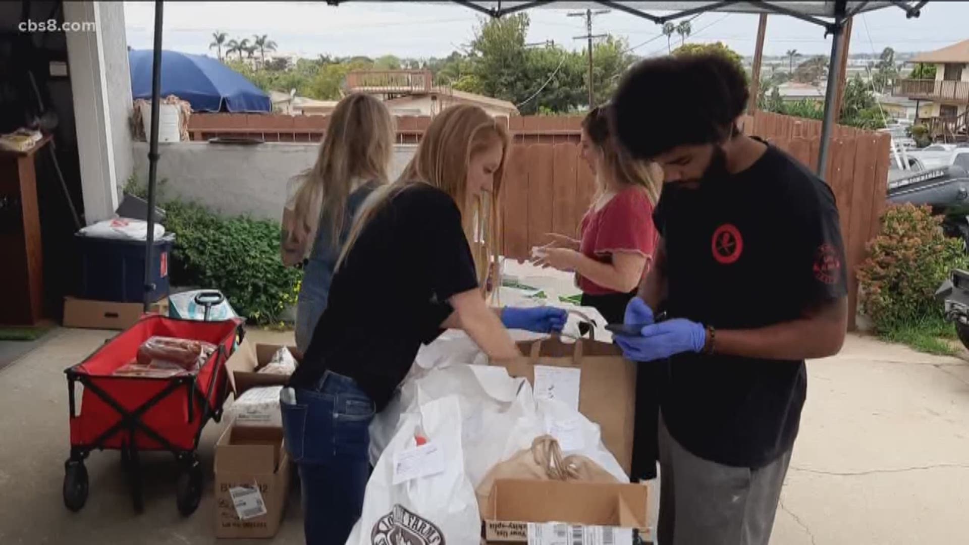 Neighbors are coming together in San Diego to deliver free groceries to seniors.