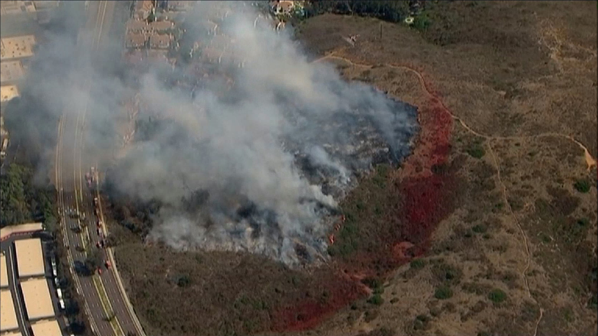The fire was reported around 2:30 p.m. on Friday near Camino Del Norte and Bernardo Center Drive and quickly burned 9+ acres along a hillside.
