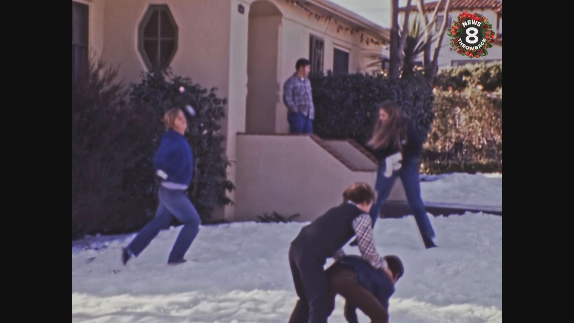 A snow machine at a Point Loma home, San Diego child Joshua Myers opens present, Pacific Beach, shopping--Christmas 1974.