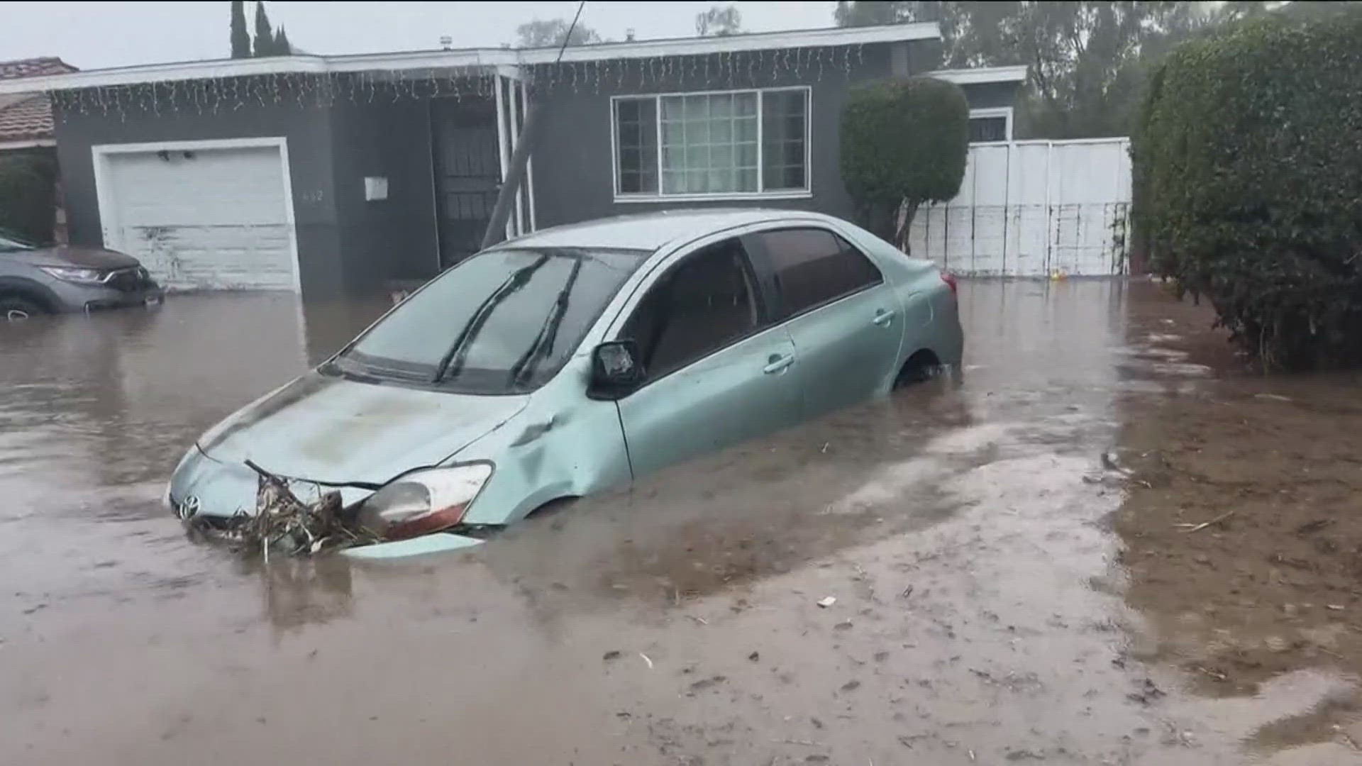 Cars floated away in San Diego County on Monday when heavy rain turned roads into rivers.