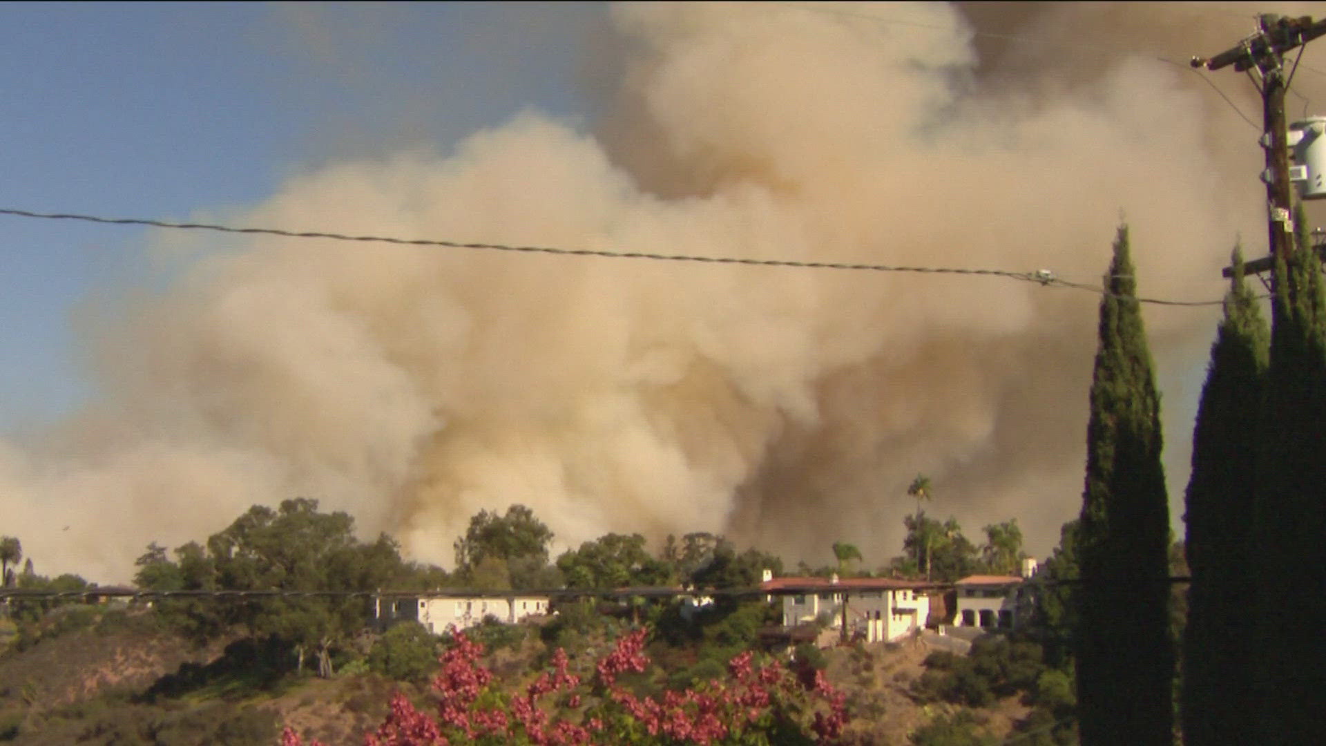 San Diego Fire-Rescue described the fire near Fairmount Ave & Montezuma Rd as fast-moving and a threat to structures in the area.