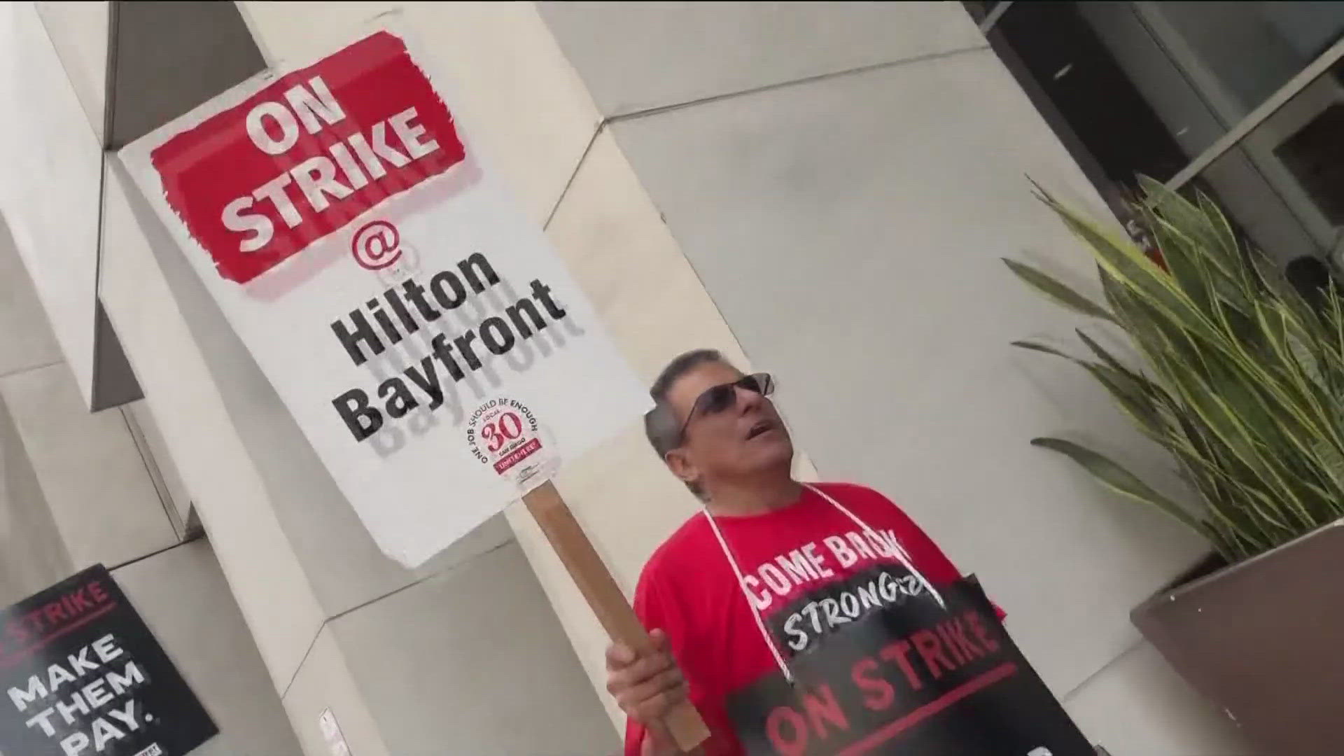 Thousands of workers represented by the UNITE HERE union are walking off the job at 25 hotels in eight cities, including Honolulu, Boston and San Francisco.