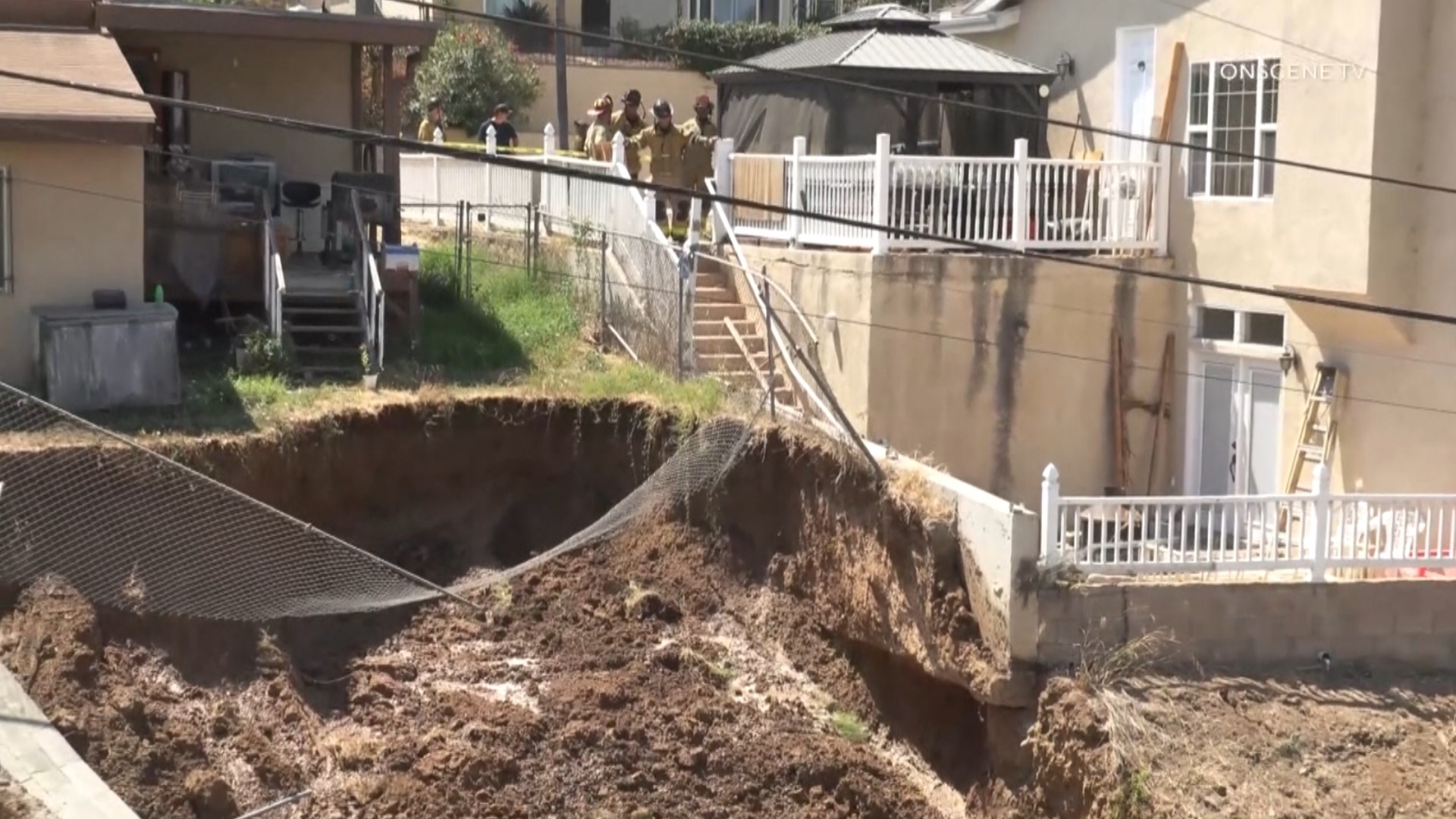 The mudslide was started by a water leak caused the ground and a retaining wall to collapse.