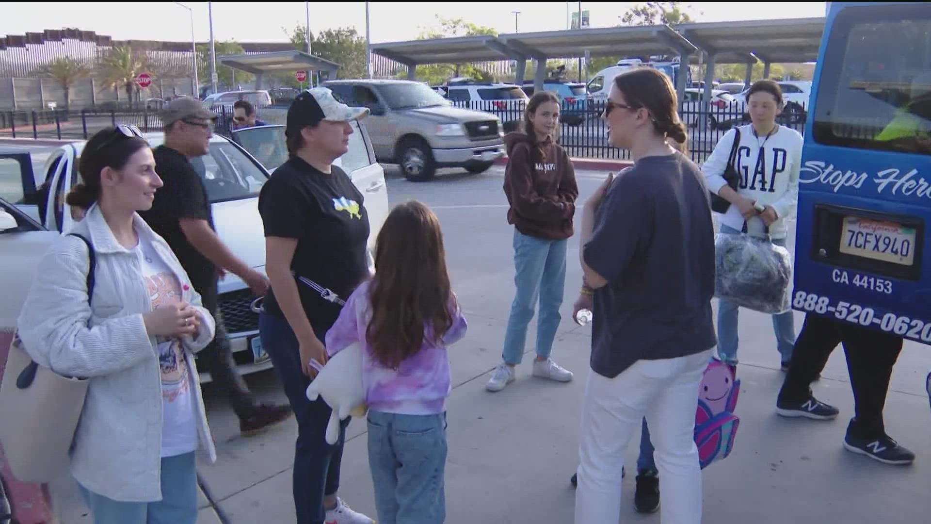 Ukrainians who have crossed the border have gathered at the west pedestrian building at the San Ysidro Transit Center.