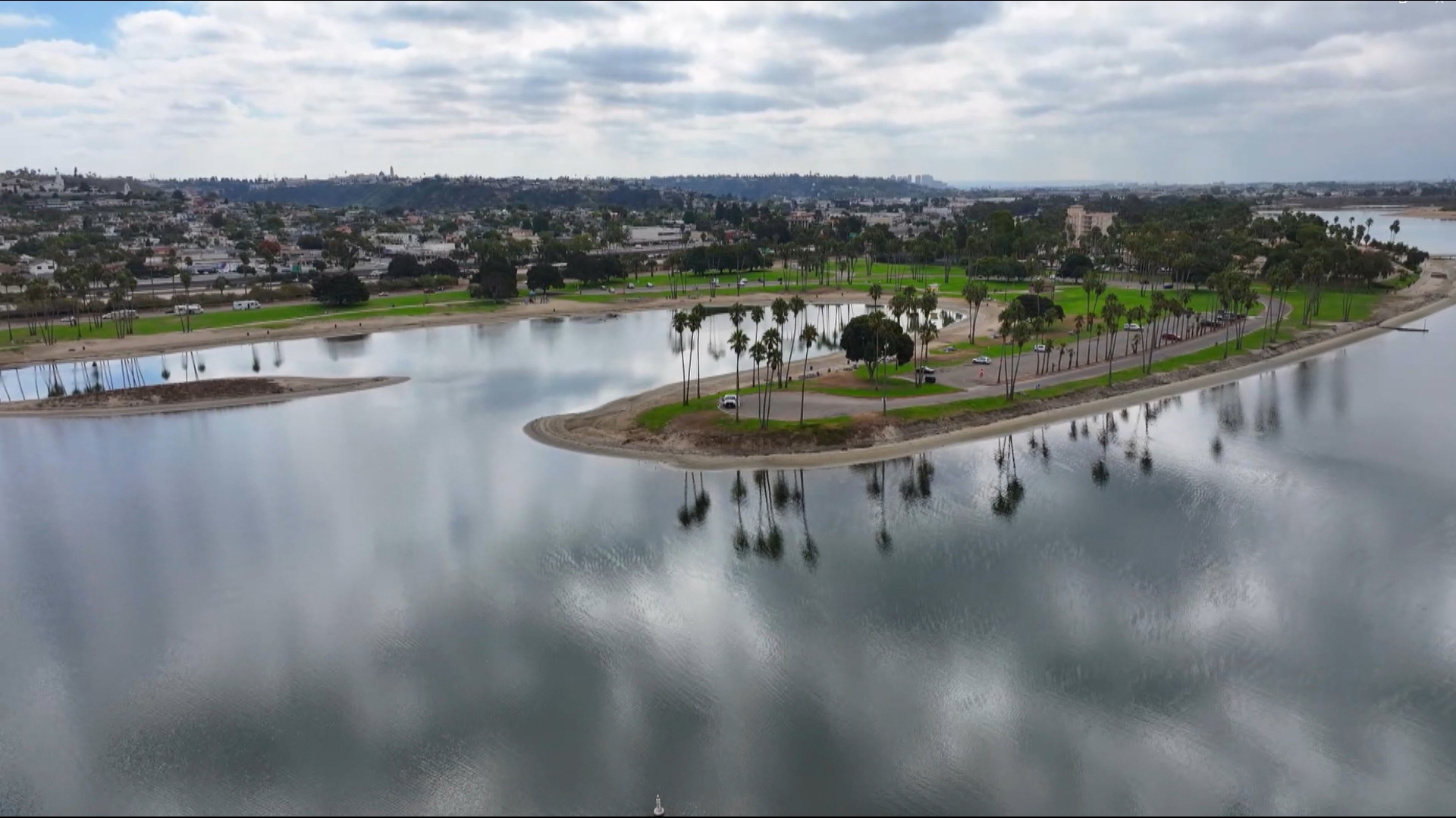 Drone video above Fiesta Island in Mission Bay on a cloudy day in San Diego.