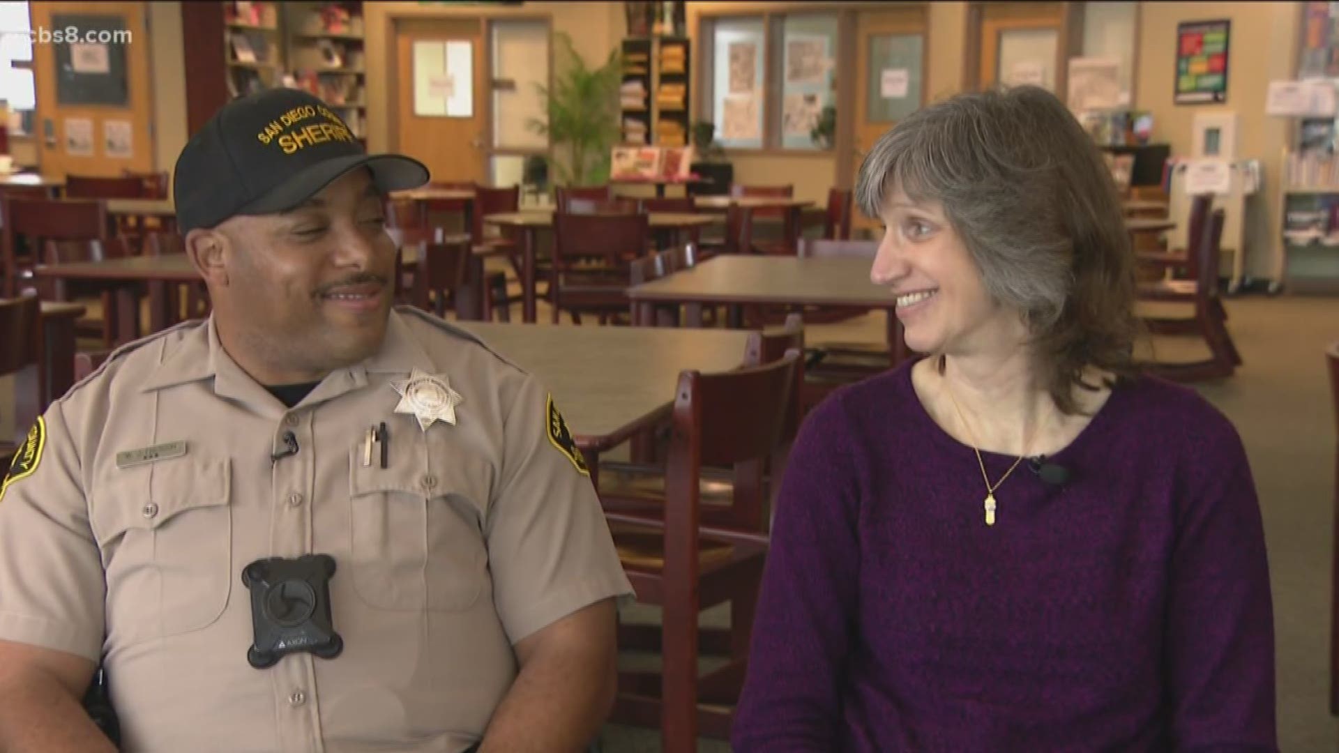 When a library aid passed out and wasn't breathing, a school resource officer saved her life.