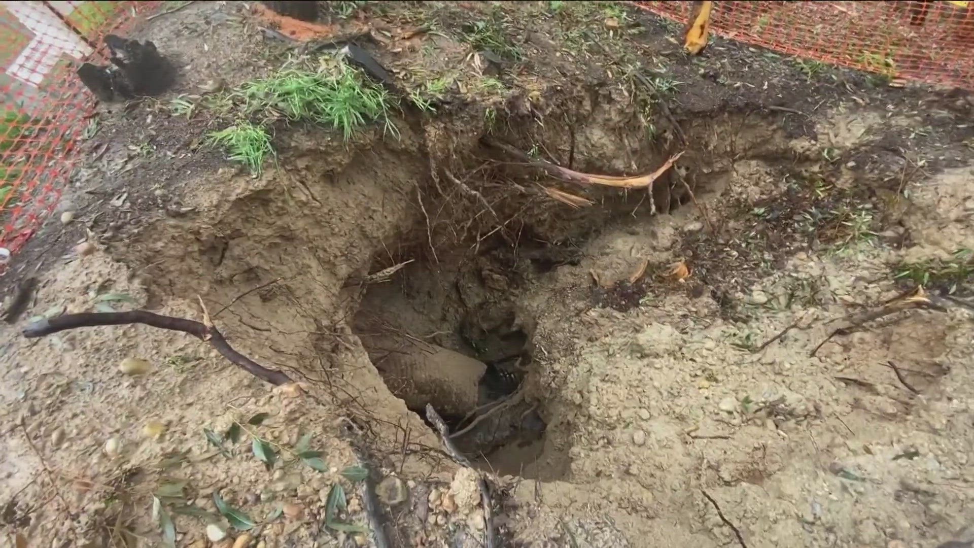 Recent storms have dumped substantial amounts of rain across San Diego, opening up new sinkholes and making an existing one even bigger.