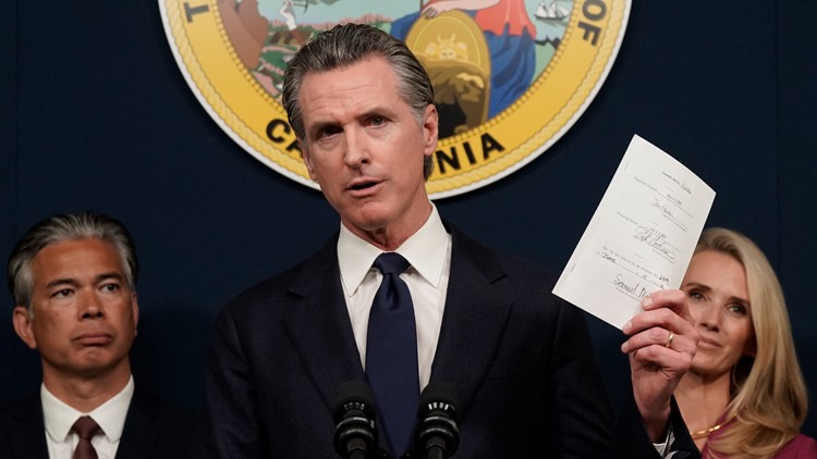 Newsom signs more than 100 bills in day, more remain on desk