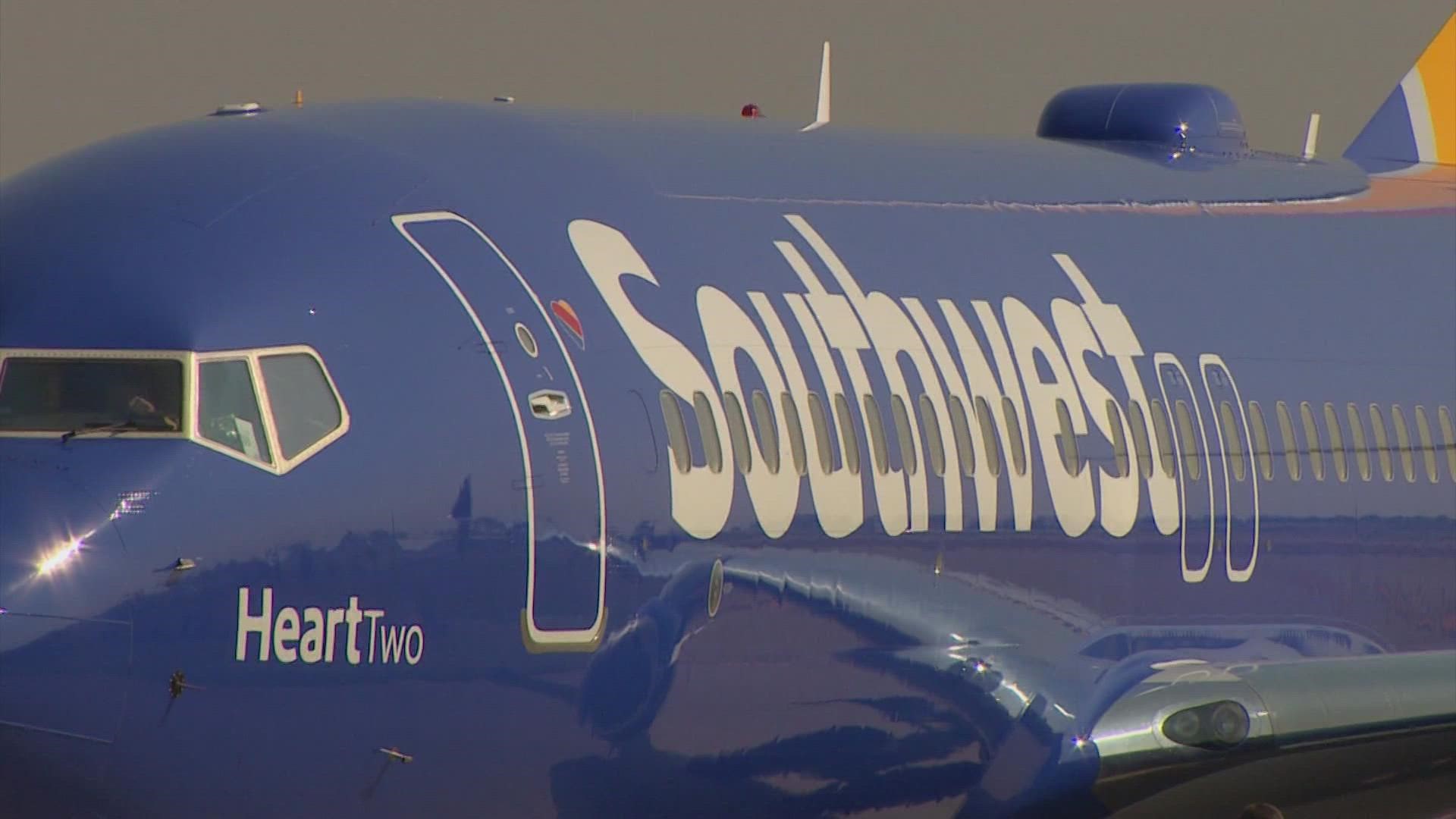 An arrest affidavit states the Southwest Airlines employee was knocked unconscious. She has since been released from the hospital.